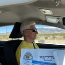 Ken Starzyk motoring across Nevada  desert while Cindy reads Vette Visisons.jpg