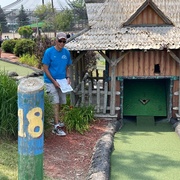 Ken reading his newsletter on the 18th hole during Mini Golf Run.jpg