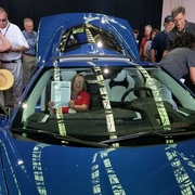 Carolyn Samuelson displaying Vette Visions in a C8 Corvette during the Reveal.jpg