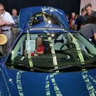 Carolyn Samuelson displaying Vette Visions in a C8 Corvette during the Reveal.jpg