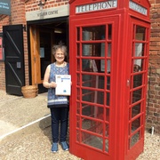 Susan Chamberlain and Vette Visions  waiting for a call at a typical England phone booth.jpg