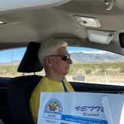 Ken Starzyk motoring across Nevada  desert while Cindy reads Vette Visisons.jpg