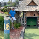 Ken reading his newsletter on the 18th hole during Mini Golf Run.jpg