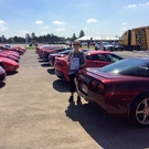 Chamberlain's parked their red  Corvette in special red parking lot at Bloomington Gold 2019.jpg